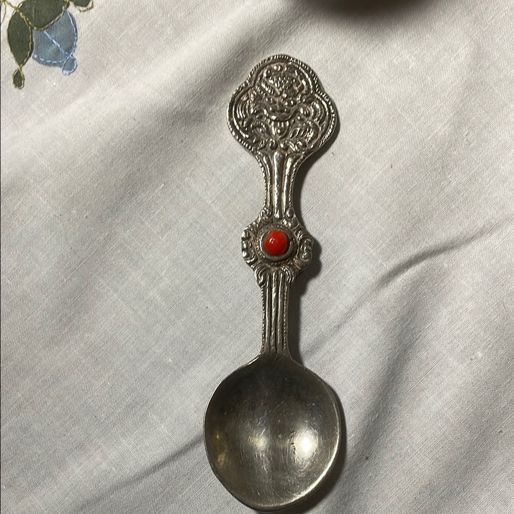 Ornate Silver Spoon with Red Accent